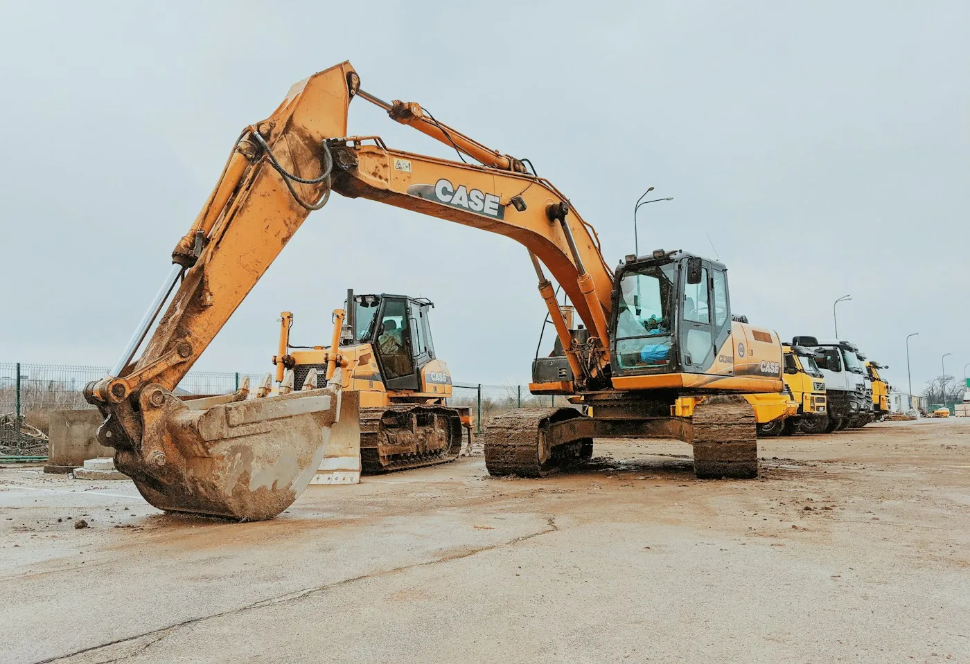Excavators on a bare construction site